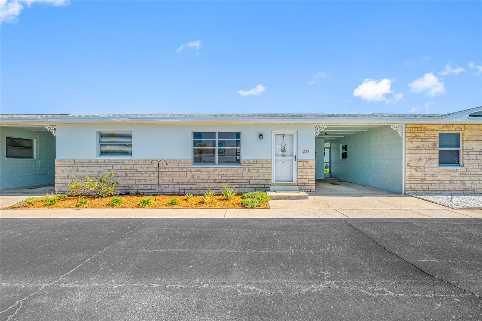 Front of home with private carport