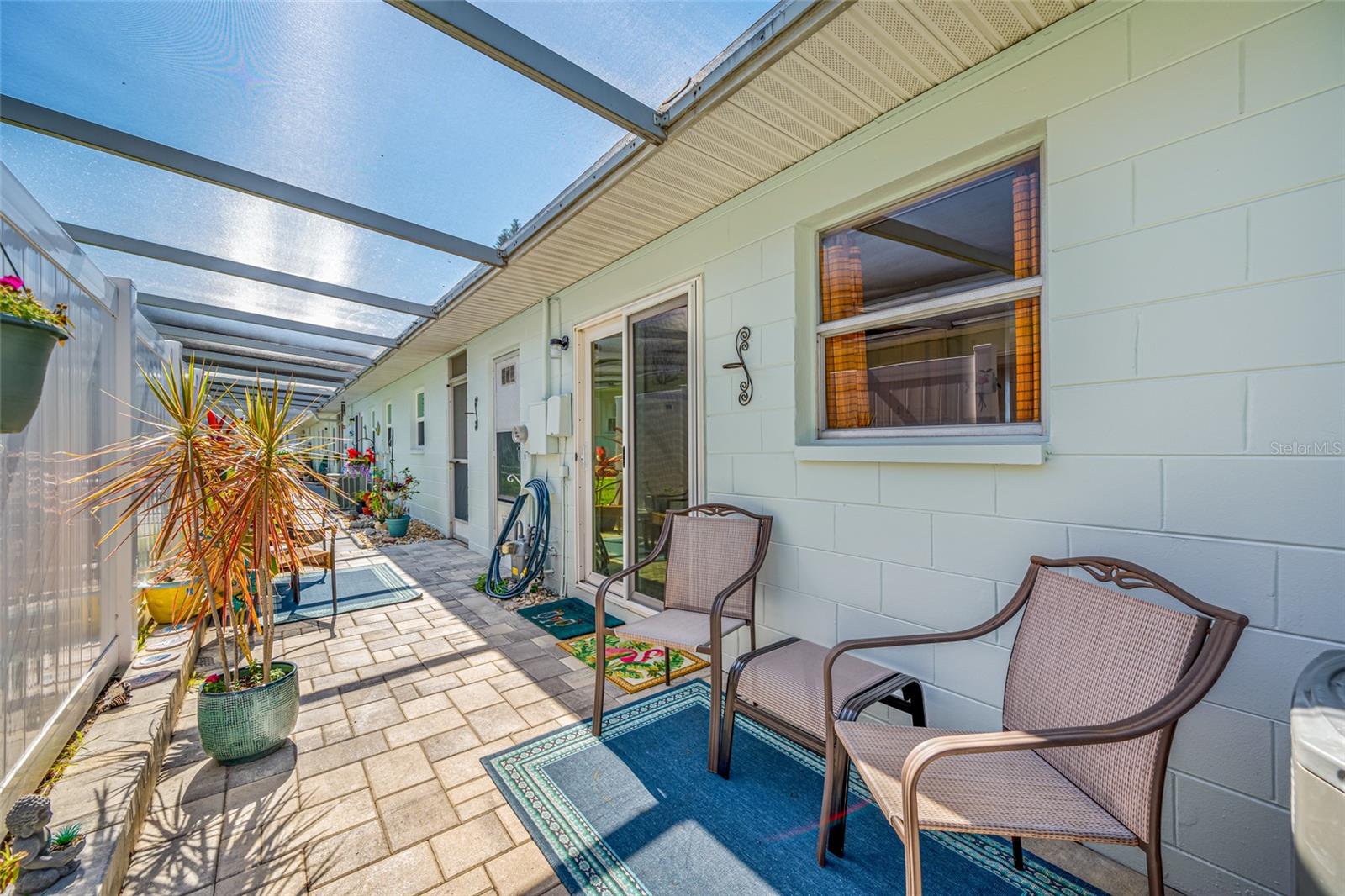 Relaxed screened lanai behind the home