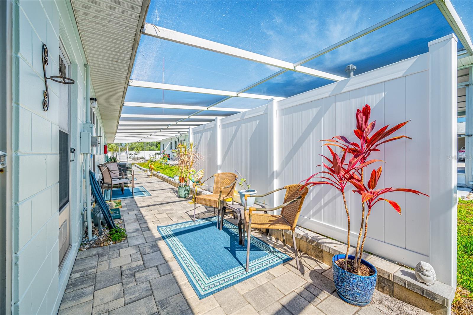 Fully screened lanai behind the home