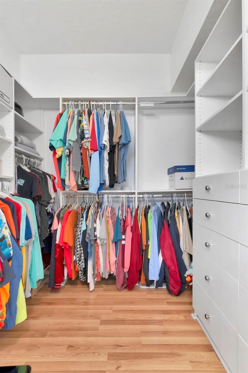 Spacious custom built-in closet with ample storage and organized shelving.