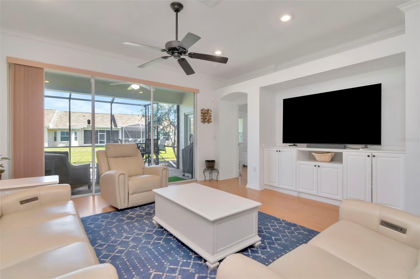 Custom built-in entertainment center adds elegance and comfort