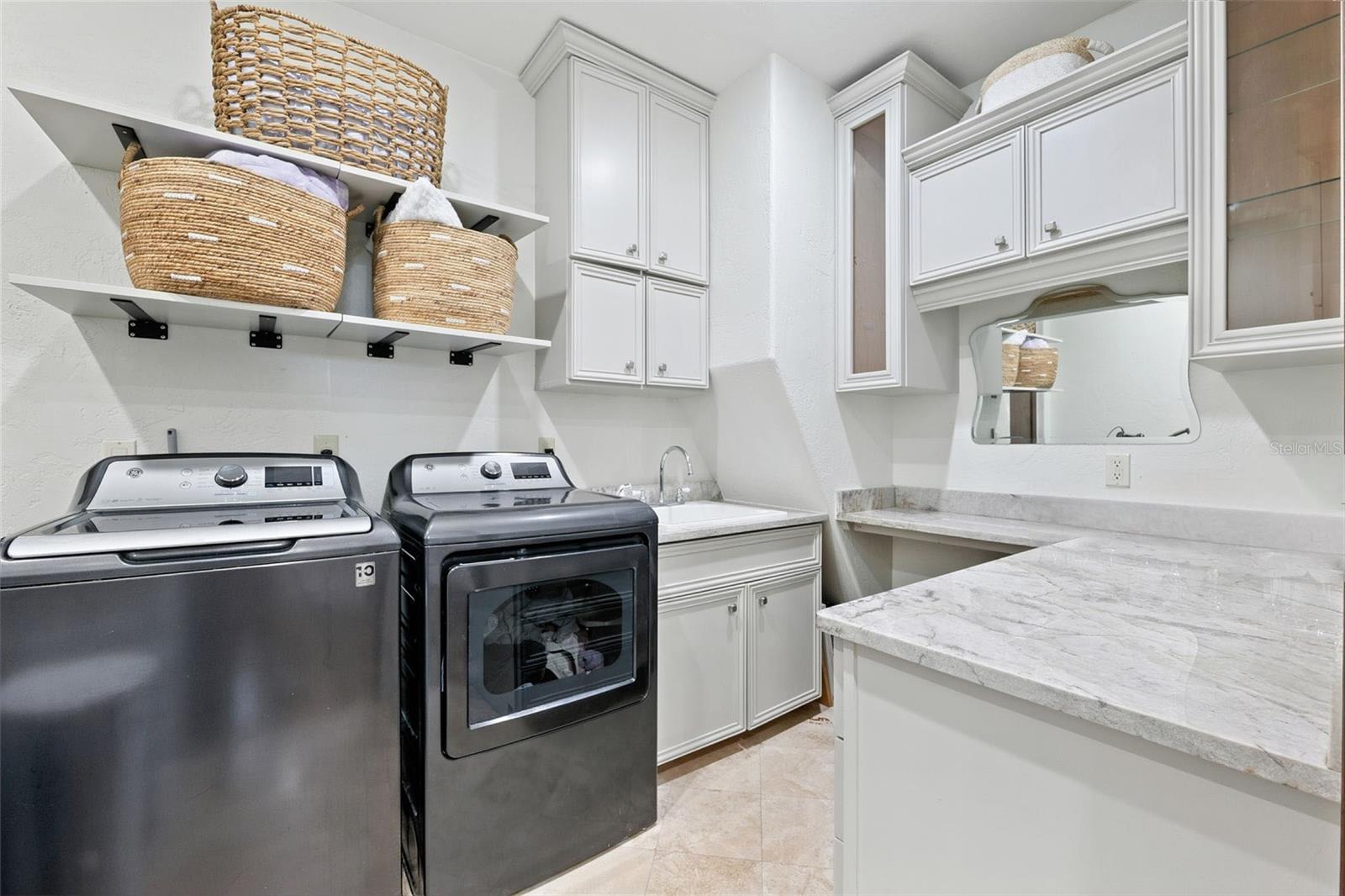 primary laundry room upstairs. connects to master closet.