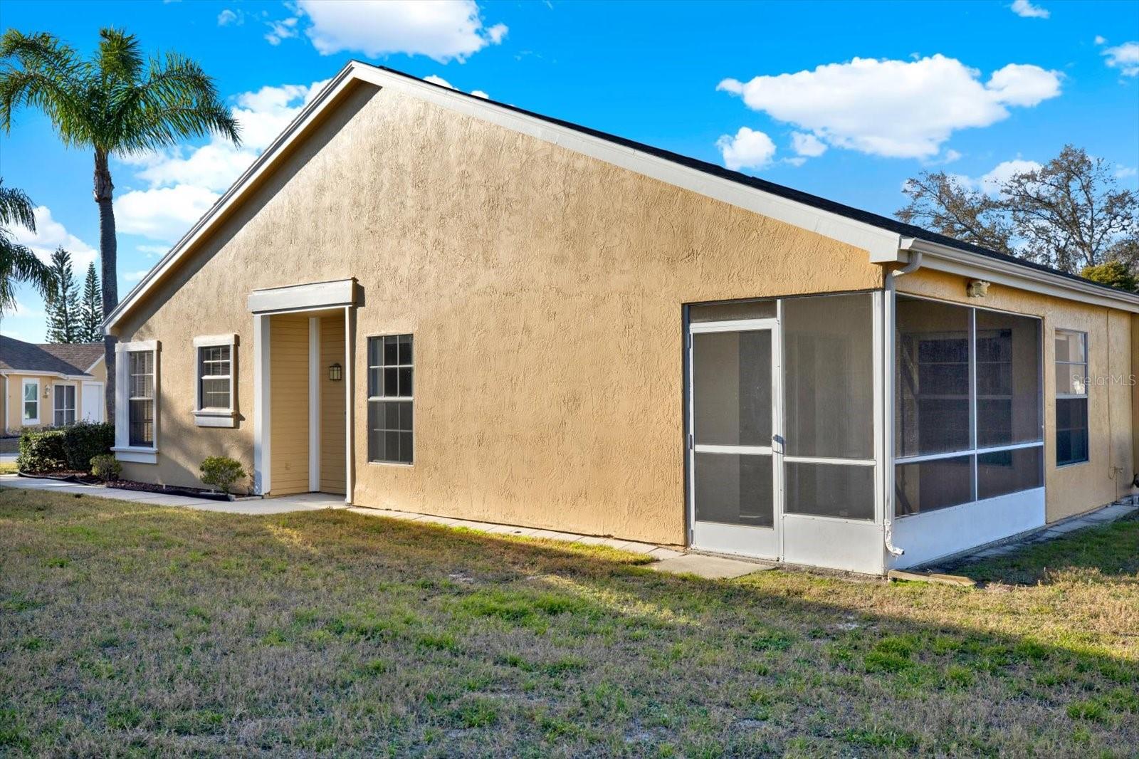 Side of Home Featuring Screened Lanai