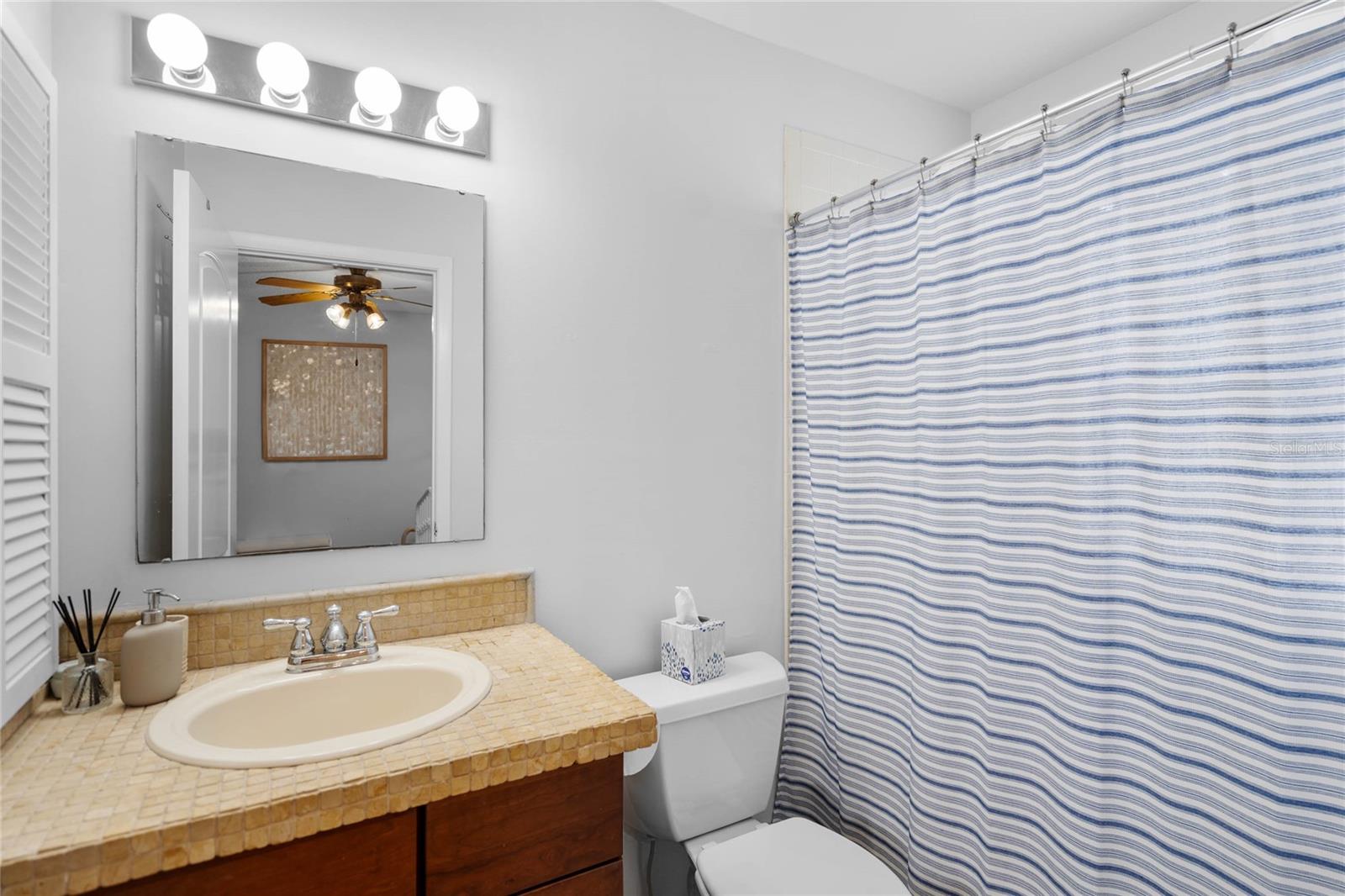 Bath 2 en suite with Bed 2 includes as conventional bathtub for younger residents.