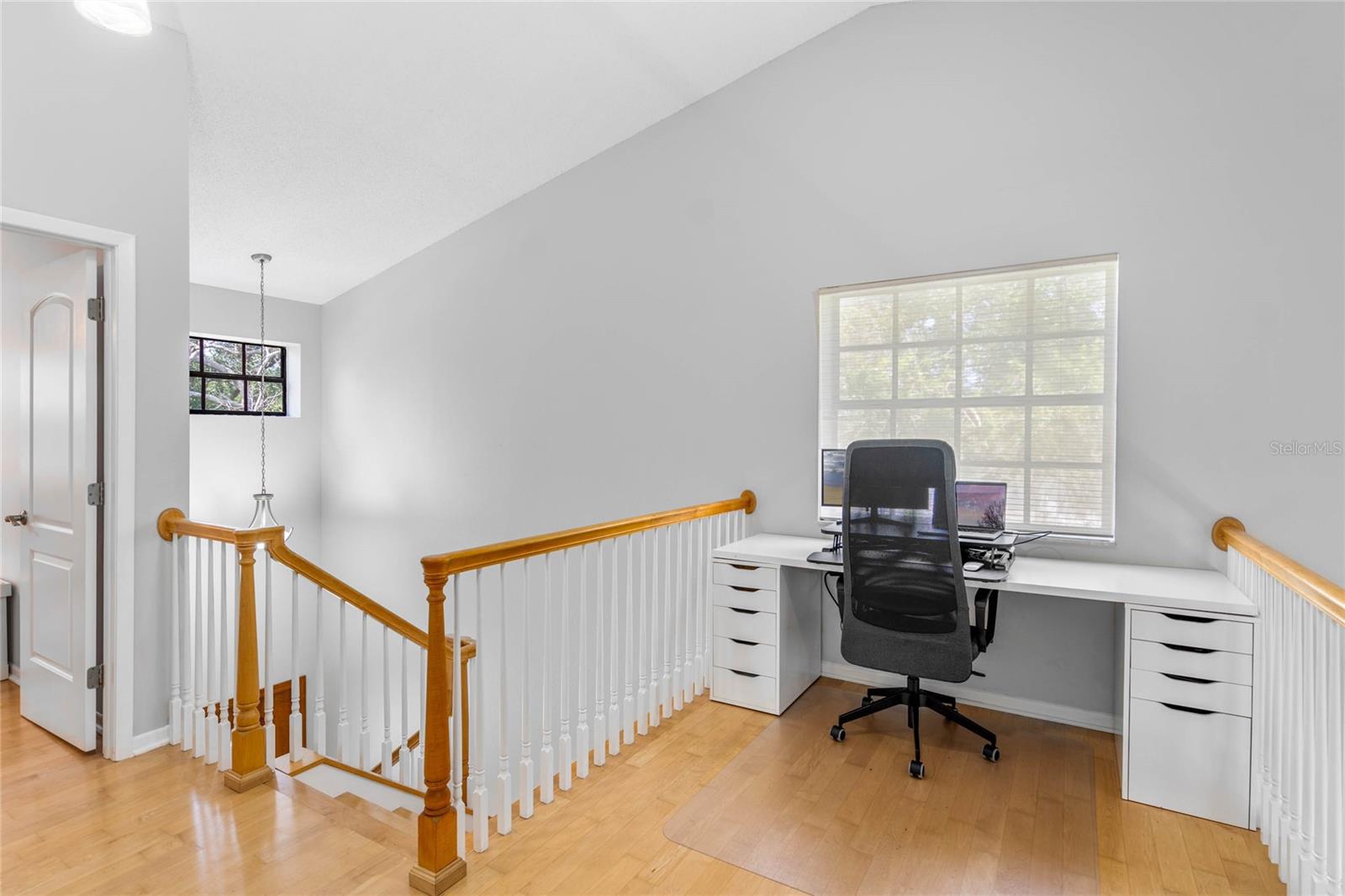 Cool additional Loft office workspace.  Great view of the oak trees and neighborhood.