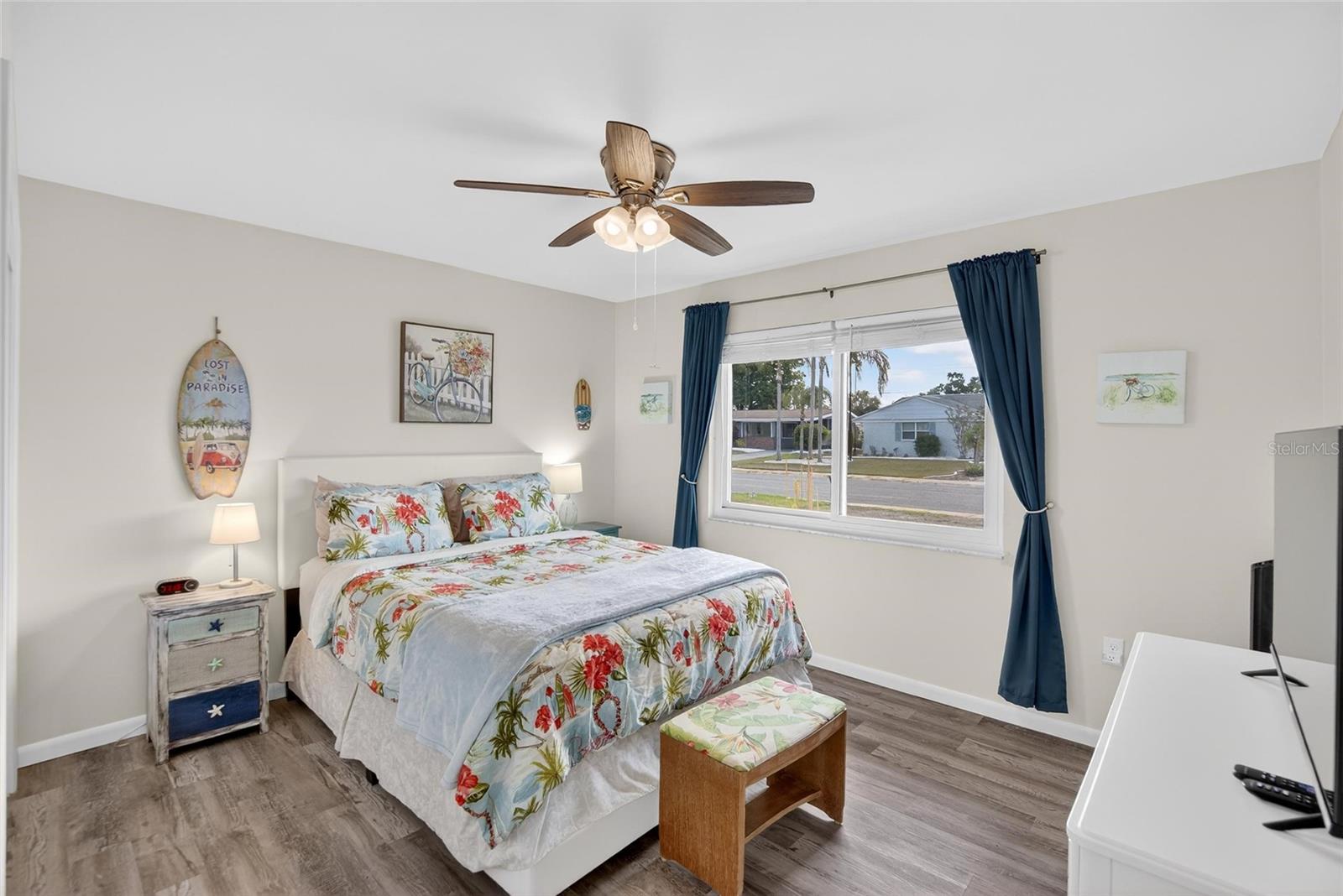 Notice the beautiful floor, large window and spacious room