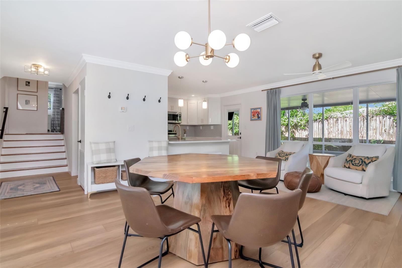 Original hardwood stairs lead to 3 bedrooms