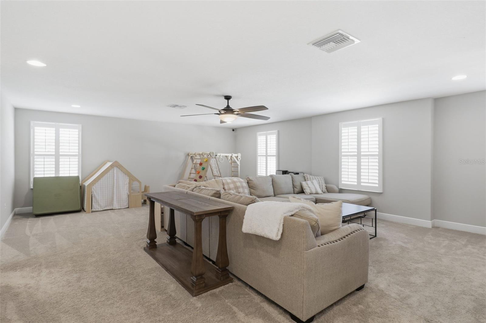 Upstairs flex space perfect for a TV room, game room, or additional entertainment area.