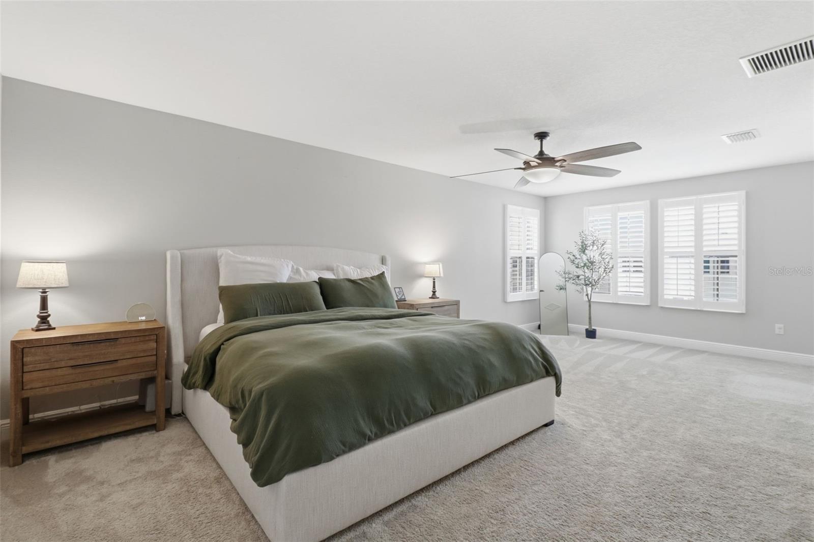 Spacious primary bedroom with bonus flex space ideal for an office or sitting area.