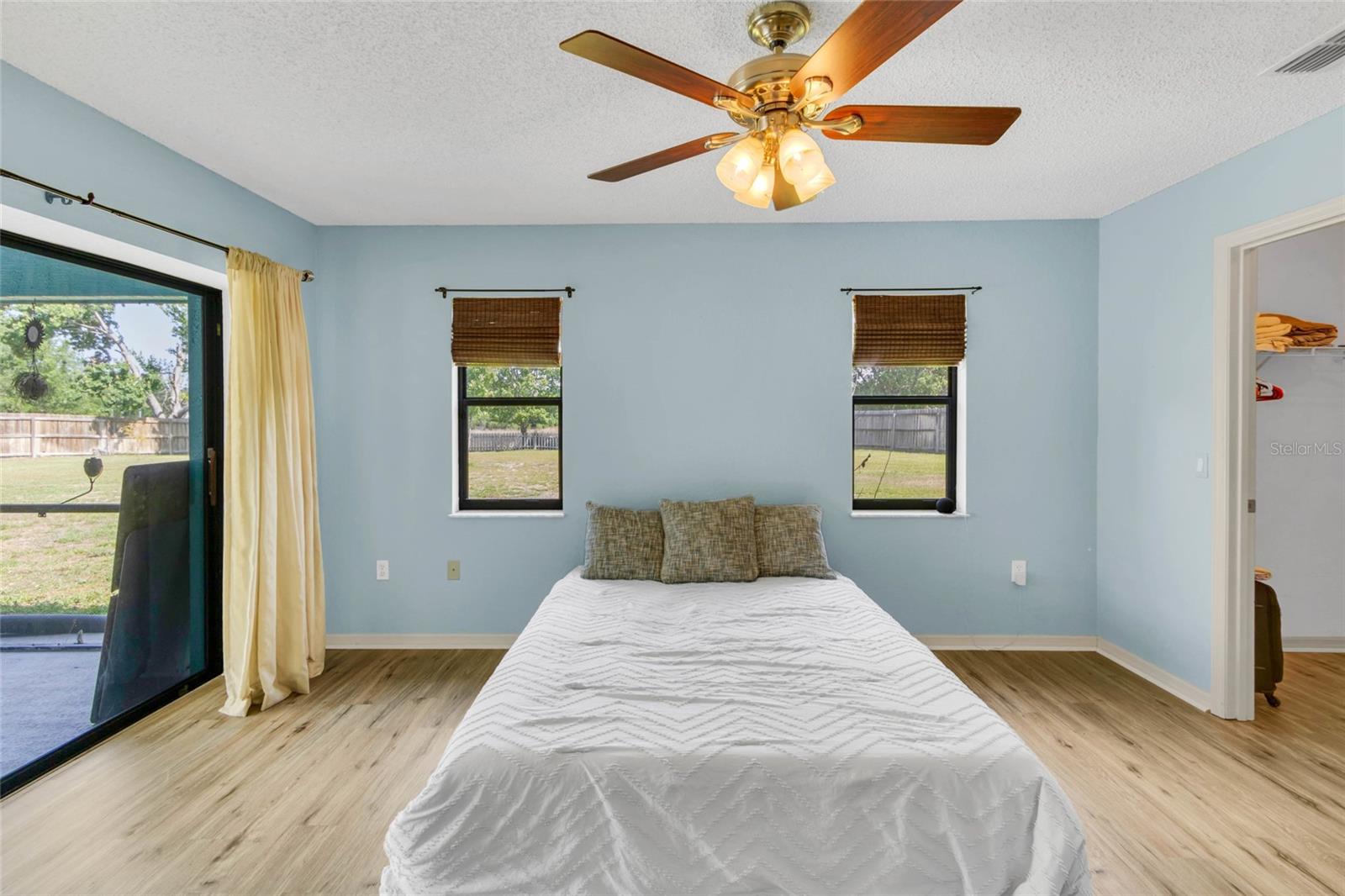 Bedroom 3 with  slider to pool deck