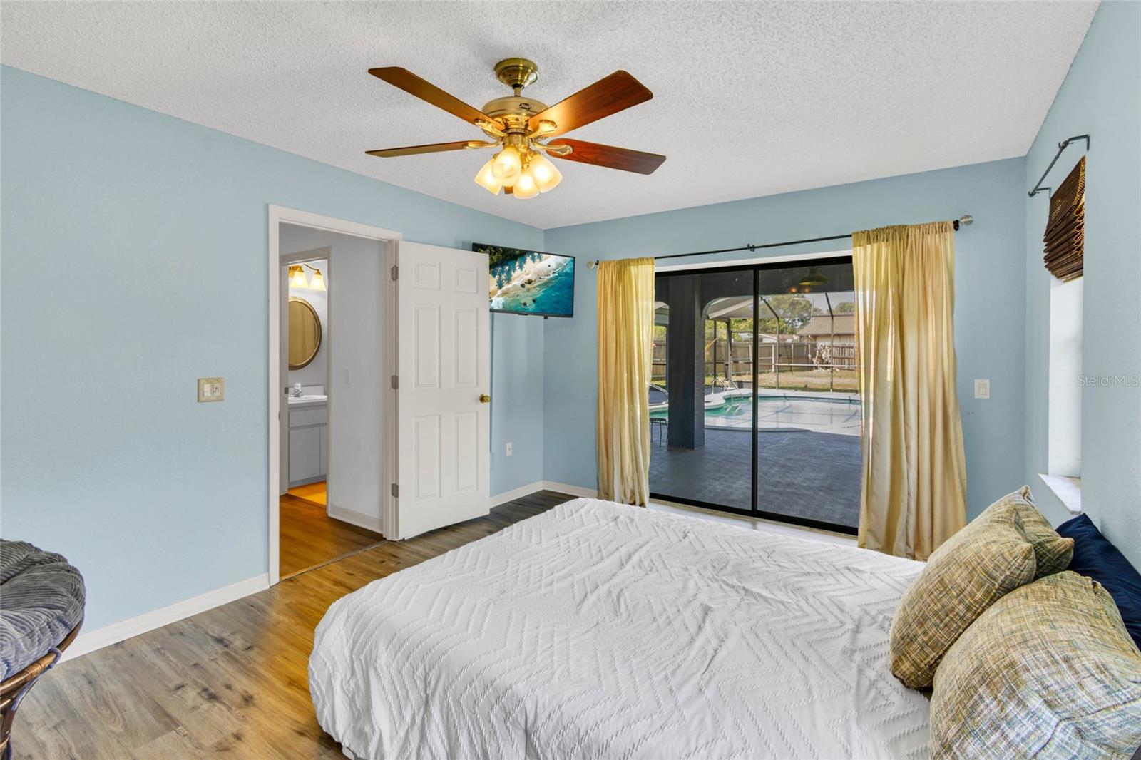 Bedroom 3 with  slider to pool deck