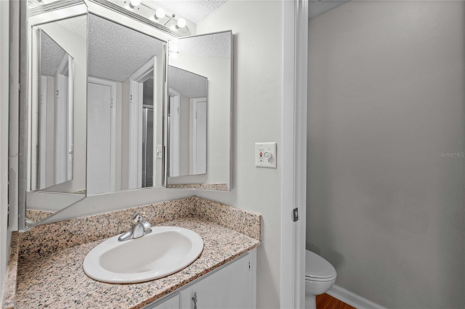 Ensuite, with separate shower, toilet and linen closet.