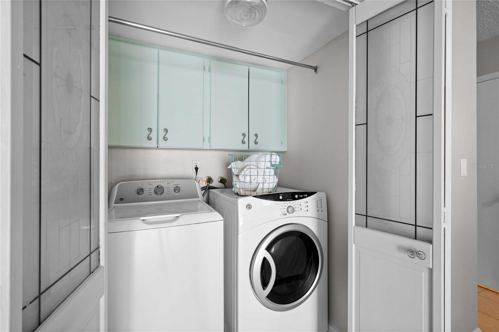 Laundry closet with storage on first floor.