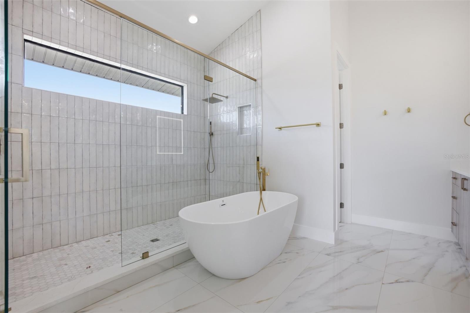 Large walk-in shower and soaking tub