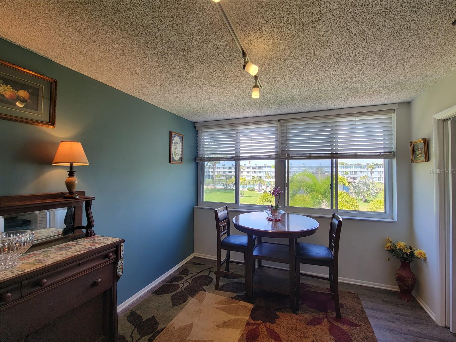 Kitchen & Courtyard Connection: The heart of the home flows seamlessly into this scenic eating area.