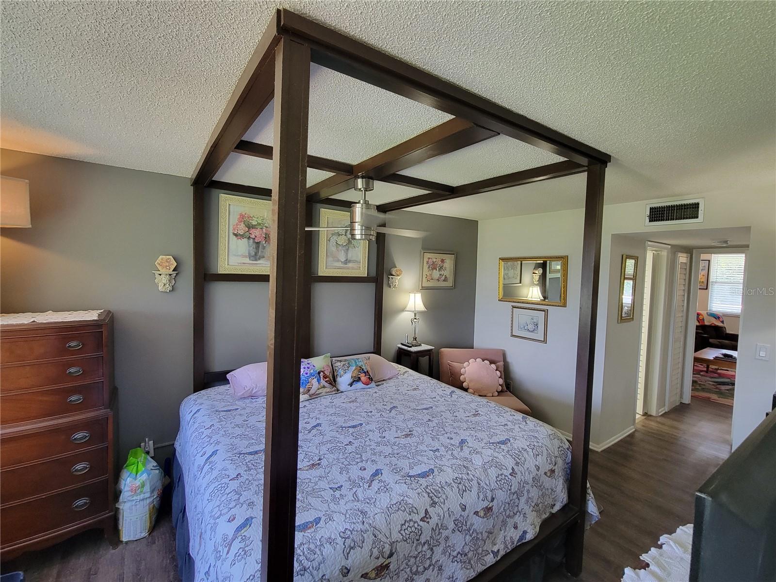 Courtyard-View Primary Suite with Attached Four-Poster Bed