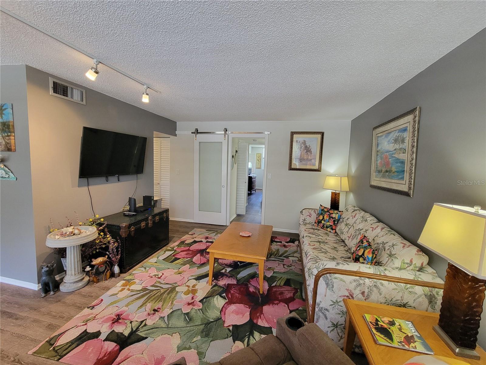 Living Room with master bedroom access in background