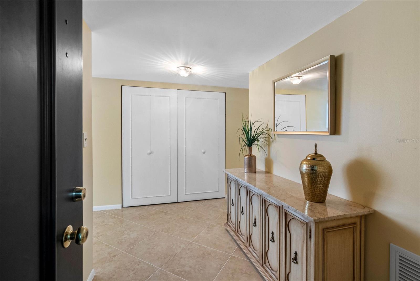 Front Door Entry to Foyer wall closet