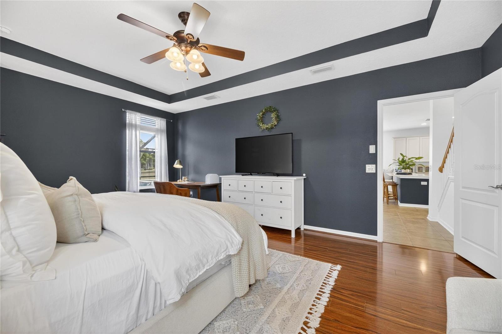 Primary bedroom has an overhead fan
