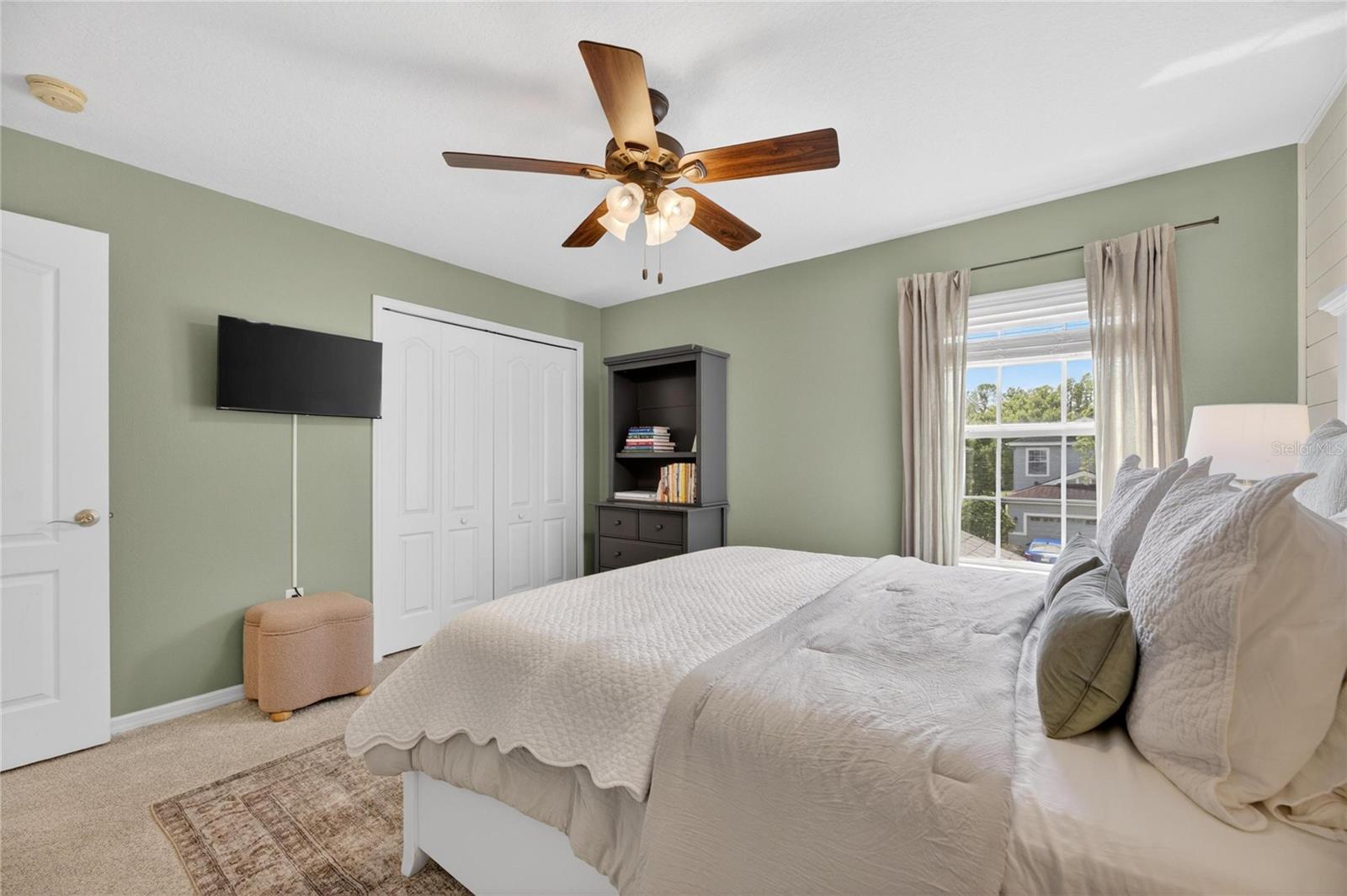 Upstairs guestroom 1 fas an overhead fan