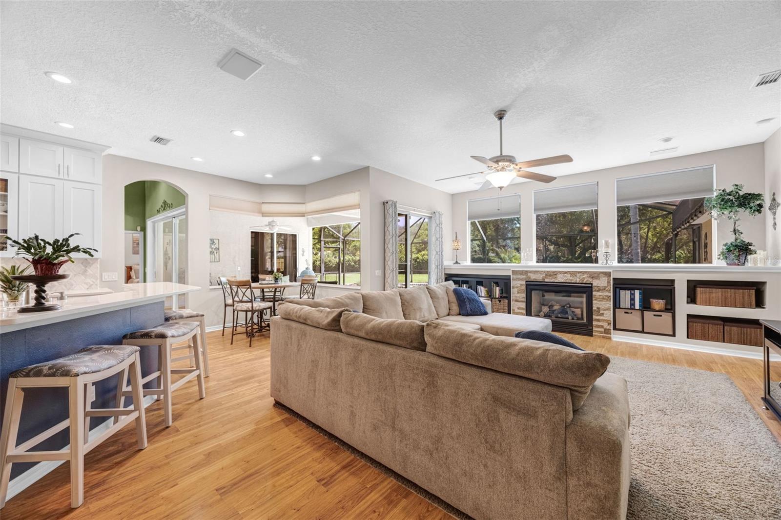 Soaring ceilings, a plethora of natural lighting, and a beautiful Gas Fireplace make this area so welcoming!