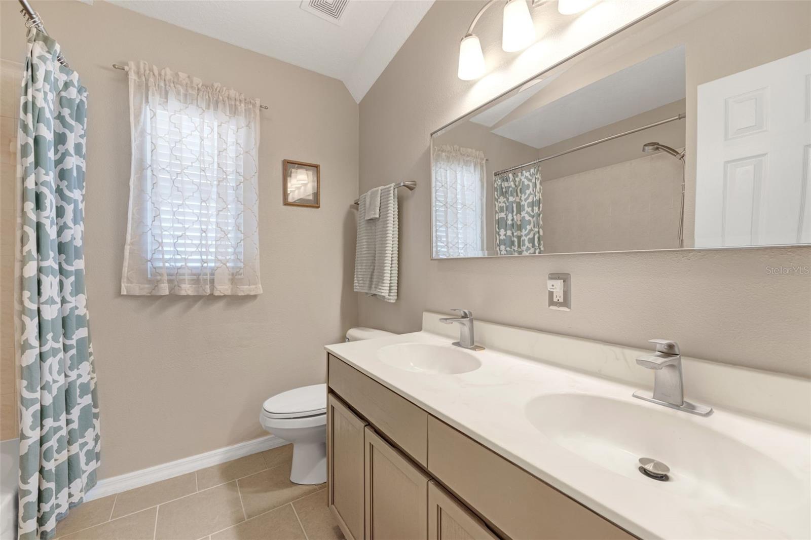 Two secondary bedrooms share the hall bathroom.