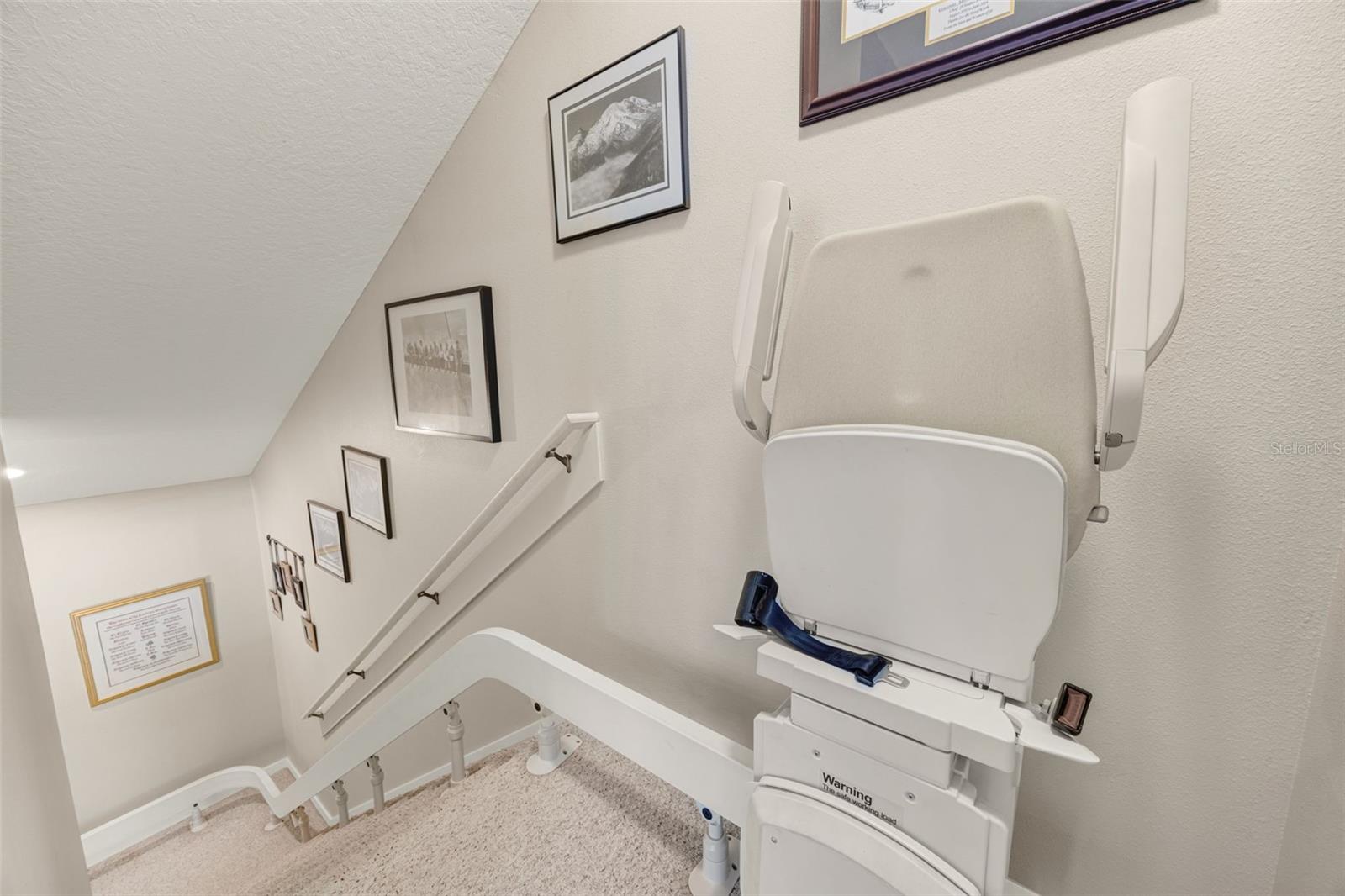 An electronic chair climbs the stairs, and can easily be removed if desired.