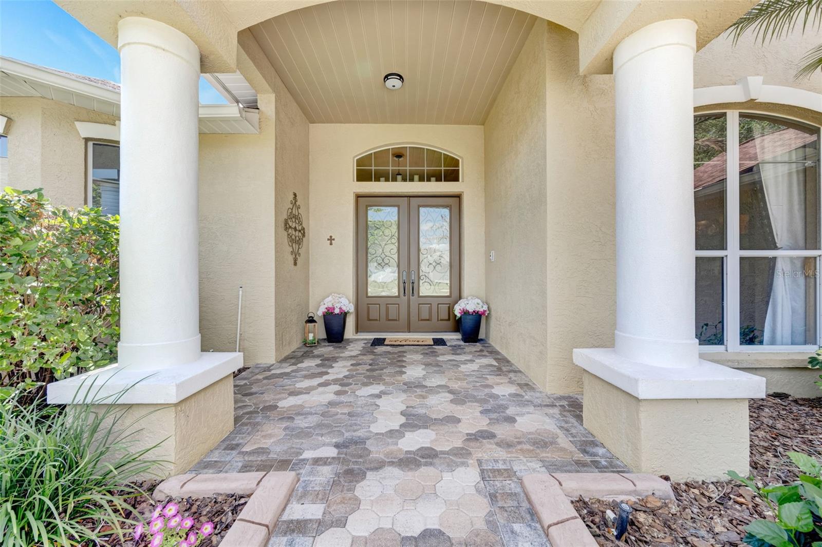 Brick paver walkway..... Double-front door entry.....and they are 8-foot doors instead of the standard 7-foot doors.