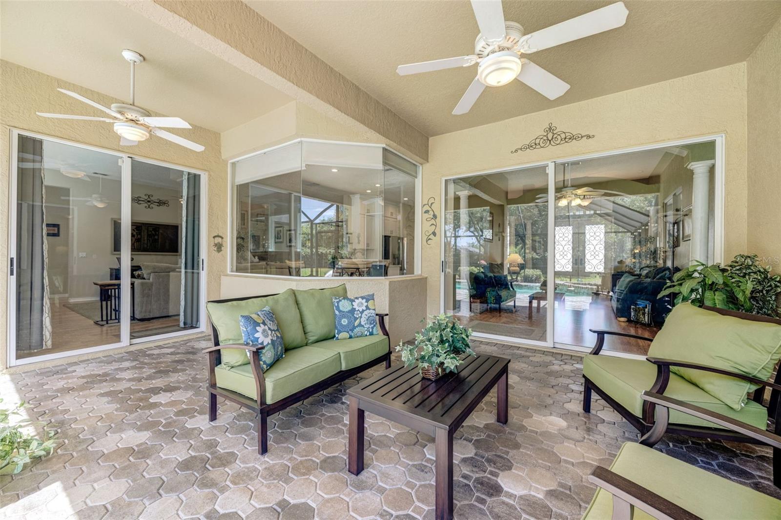 Two sets of glass sliders bring the outdoor living space inside on beautiful days.