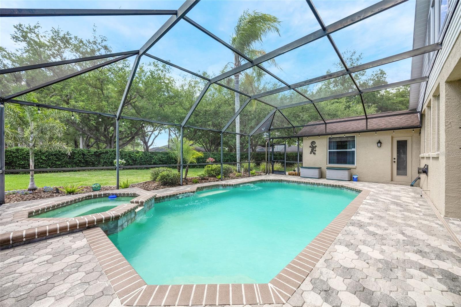 A gorgeous and very private backdrop beyond the screened-in area.