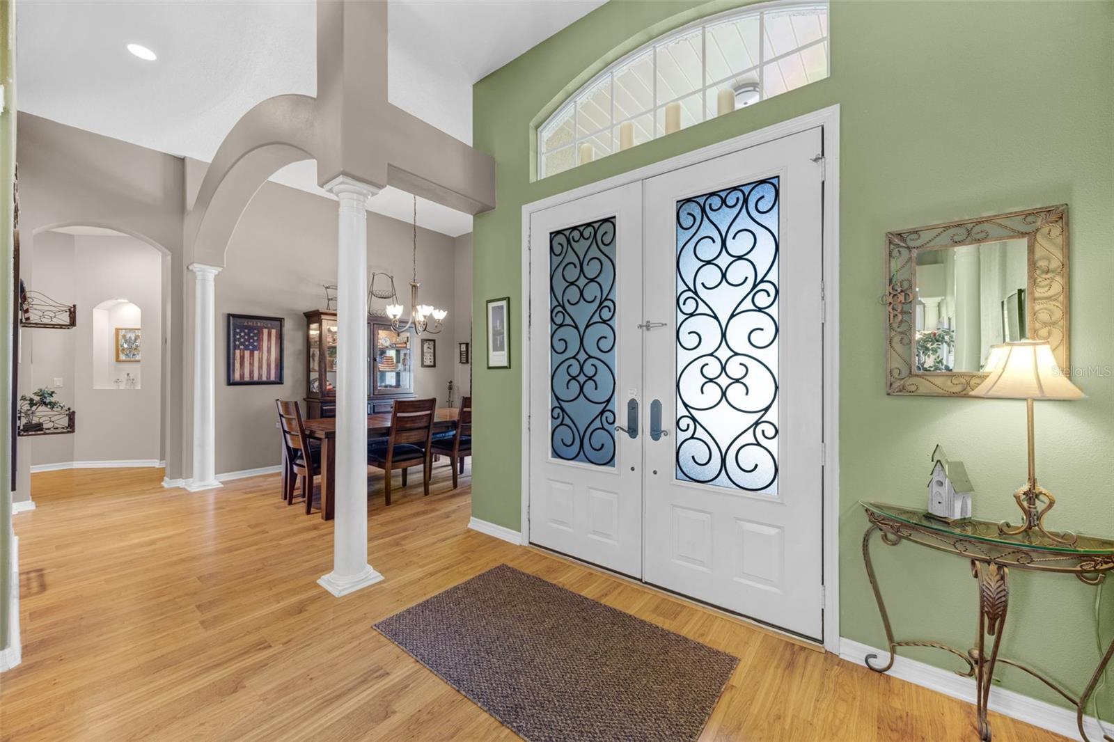 Welcome inside this extremely well-maintained dream home!  Look at those beautiful entry doors and even more beautiful laminate floors!