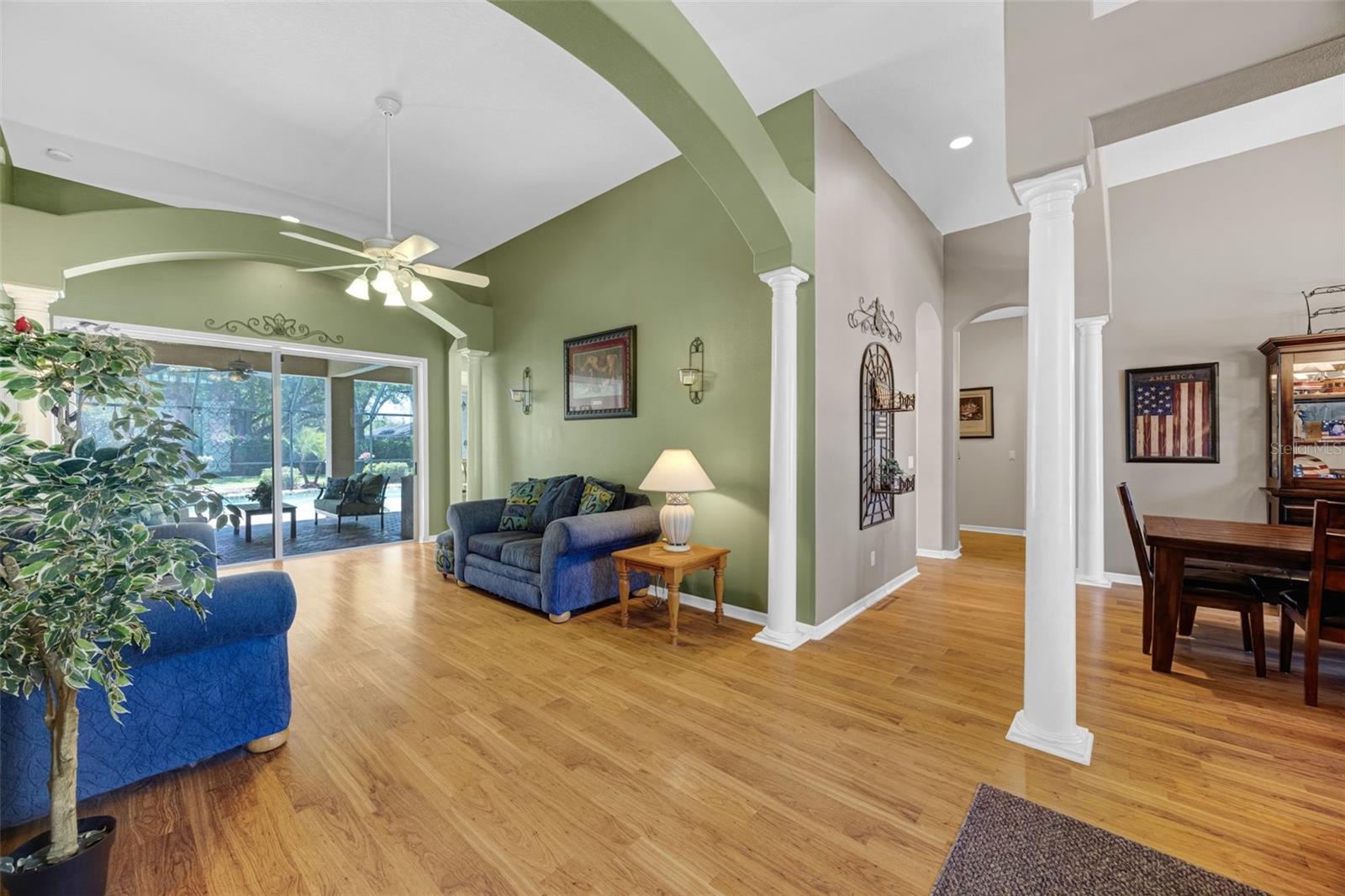 As you enter the home through the front door, you immediately notice the screened-in lanai with pool and jacuzzi.  Beautiful laminate floors cover the main areas of the home.