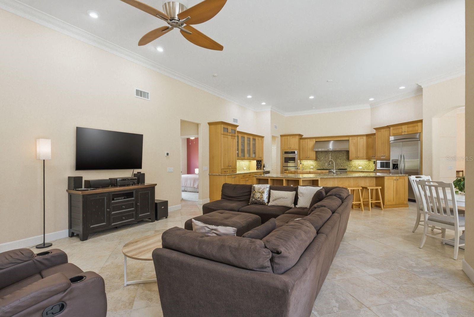 Family room and Kitchen with soaring ceilings & open concept living · 976 Cypress Cove Way Tarpon Springs FL 34688