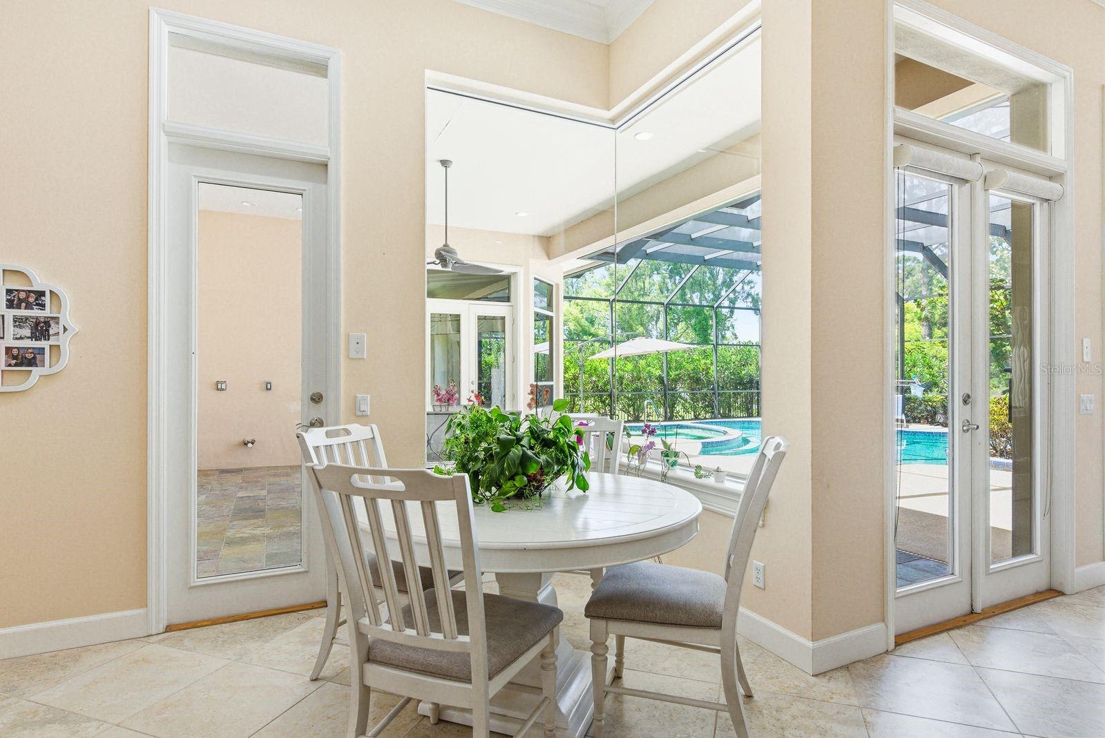 Breakfast Nook with views of Lanai and Pool · 976 Cypress Cove Way Tarpon Springs FL 34688