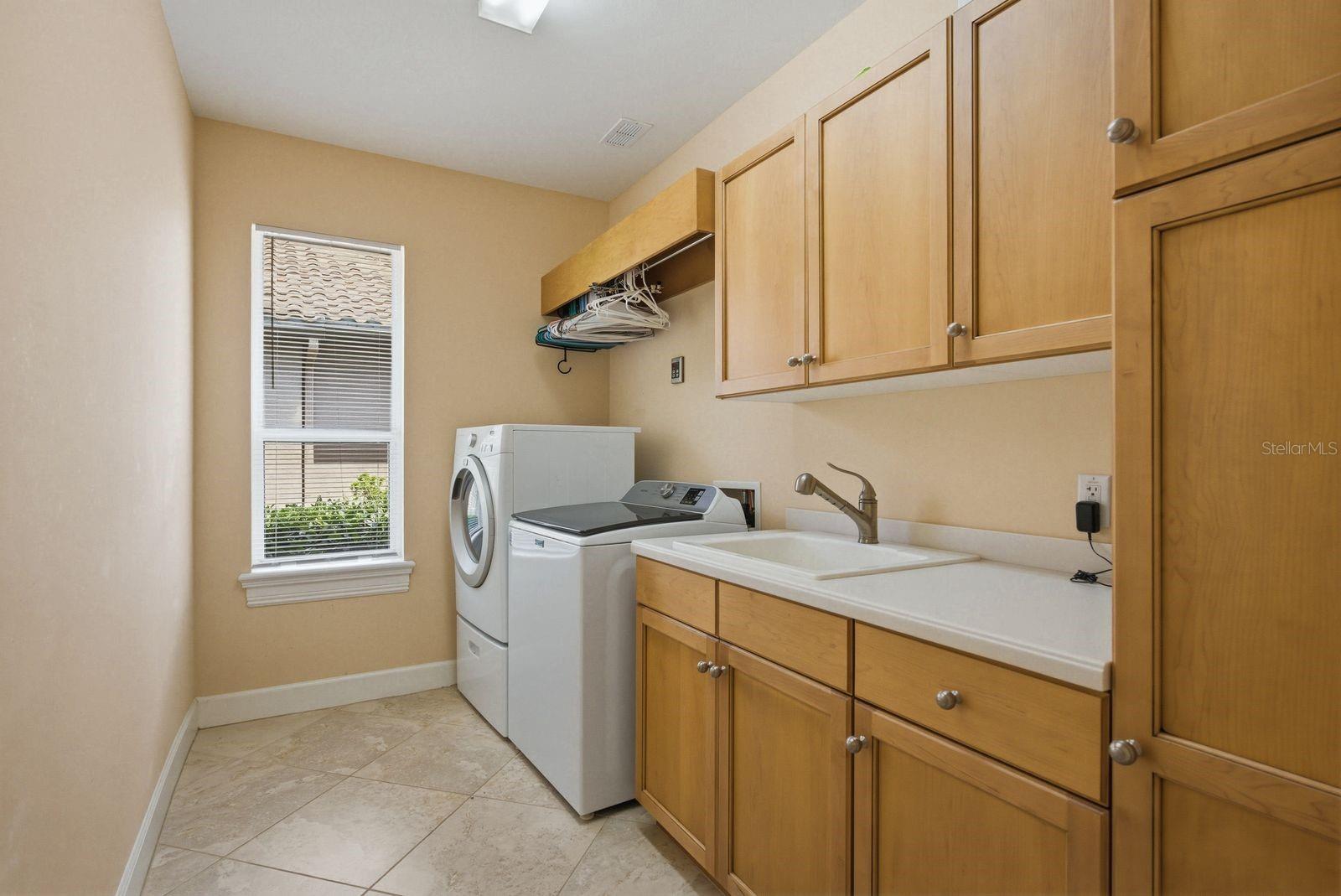 Large laundry room w/ ample storage off kitchen · 976 Cypress Cove Way Tarpon Springs FL 34688