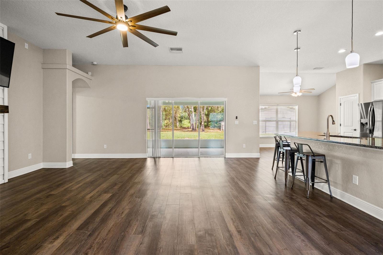 Retractable Triple Sliders to Screened Lanai