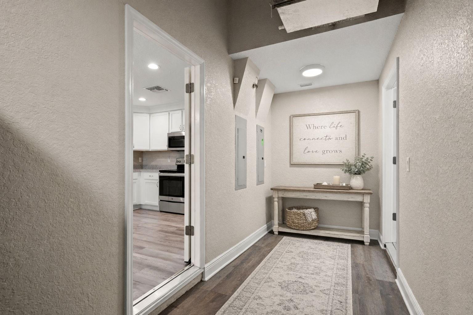 Virtually Staged Mud Room with entrance to in-law suite/guest home