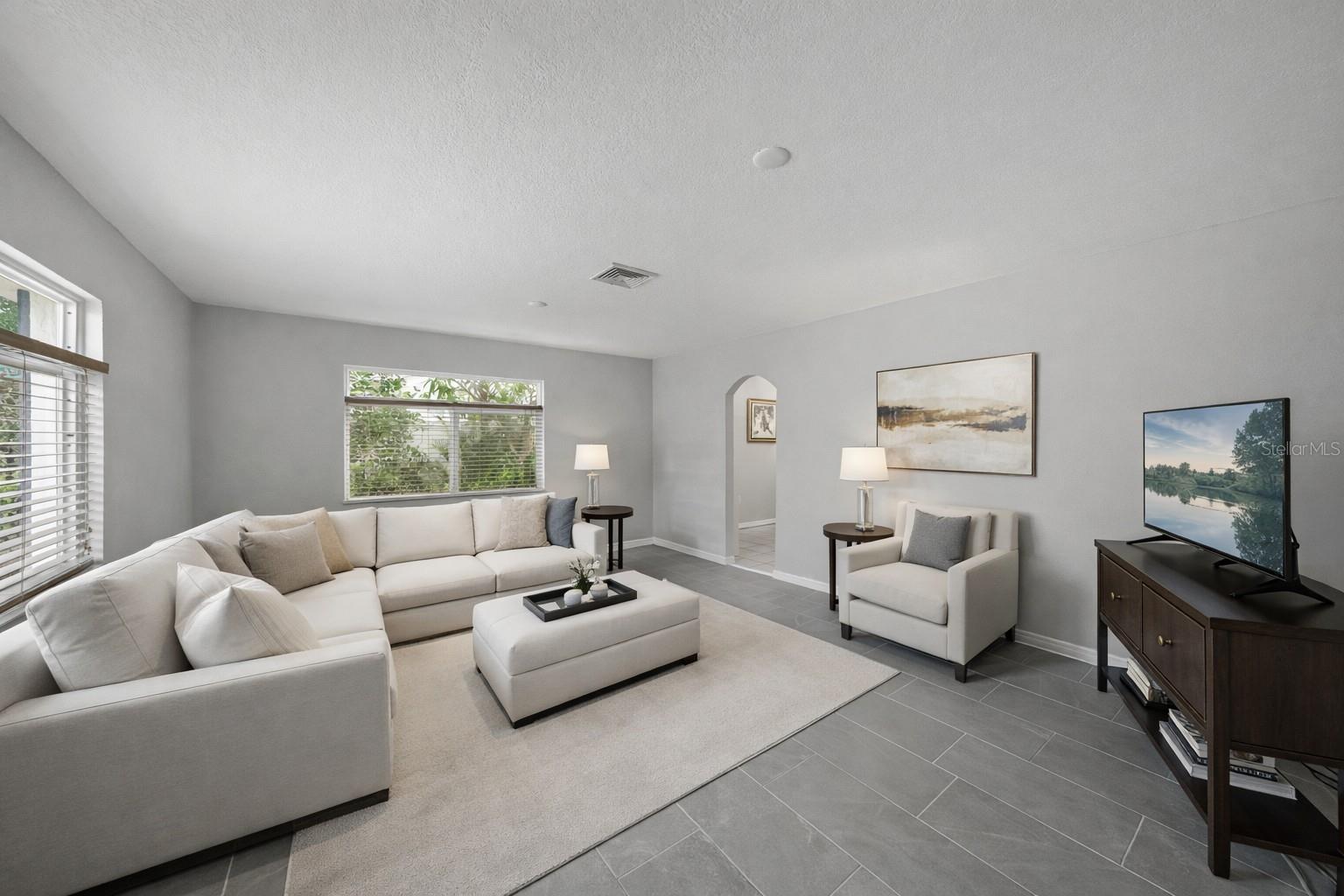 SPACIOUS Living Room with NEW Porcelain Tile Flooring