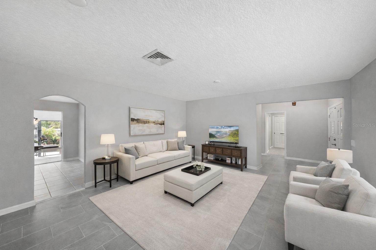 Living Room with NEW Porcelain Tile and Fresh Paint- NO POPCORN CEILINGS!