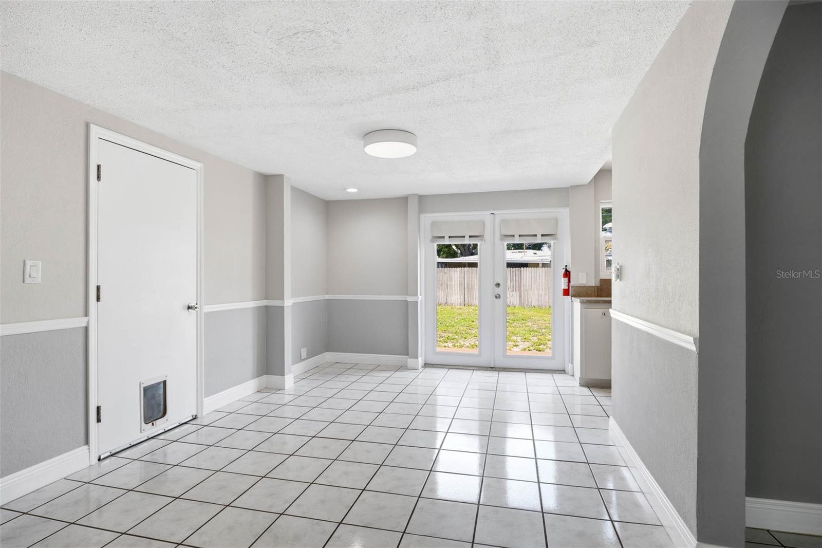 Dining Room with French Doors leading to backyard