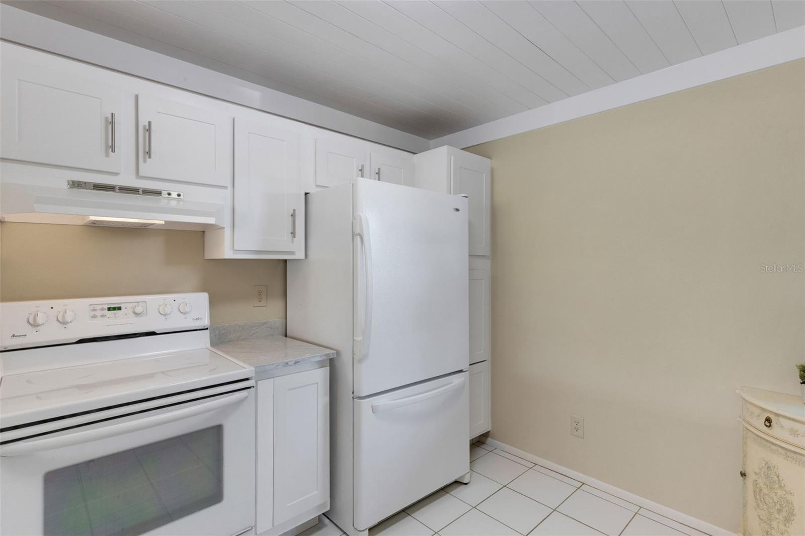 Right of stove are drawers, temporary cover shown