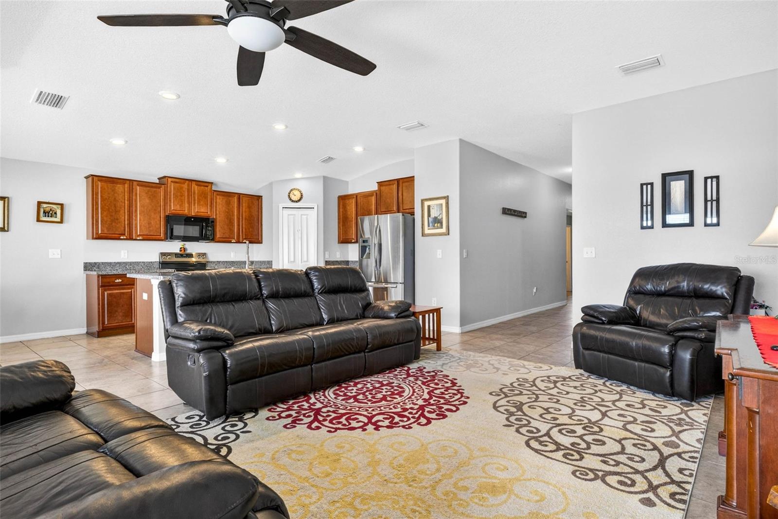 Living area with hallway towards entry and secondary bedrooms/bathroom