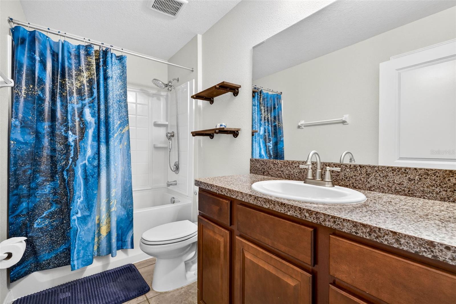 Secondary bathroom with comfort height counter tops and shower/tub combination with Rain Shower Head