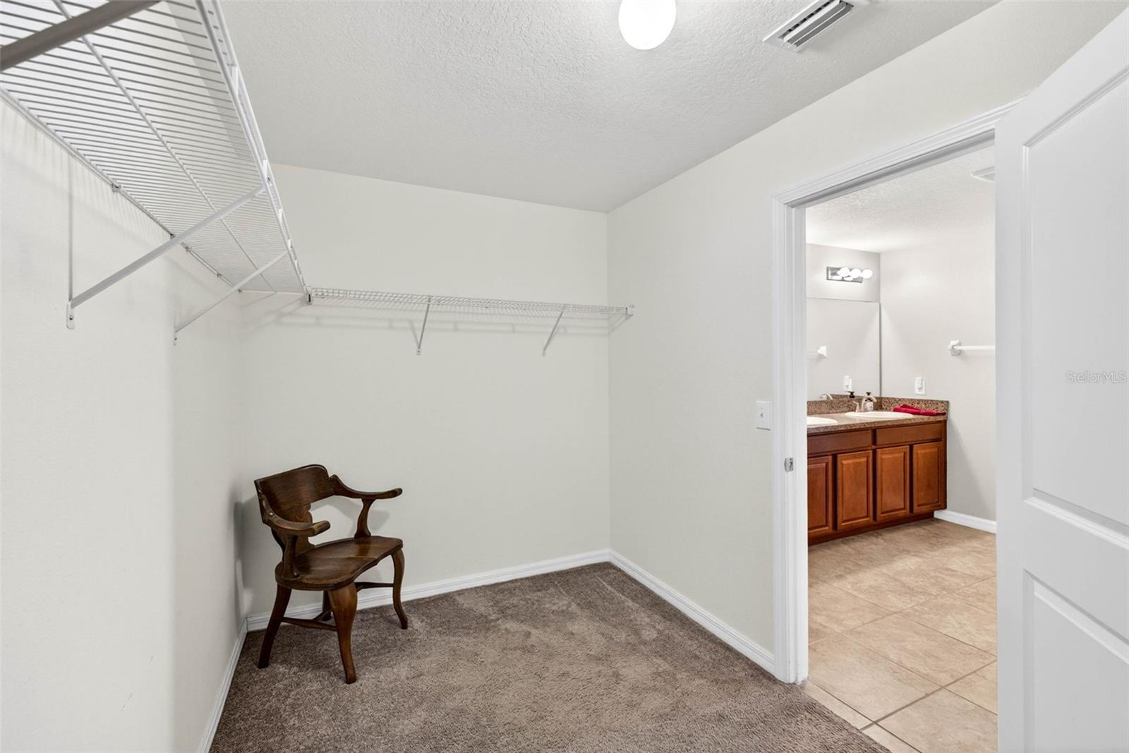 LARGE walk in closet off of primary bathroom