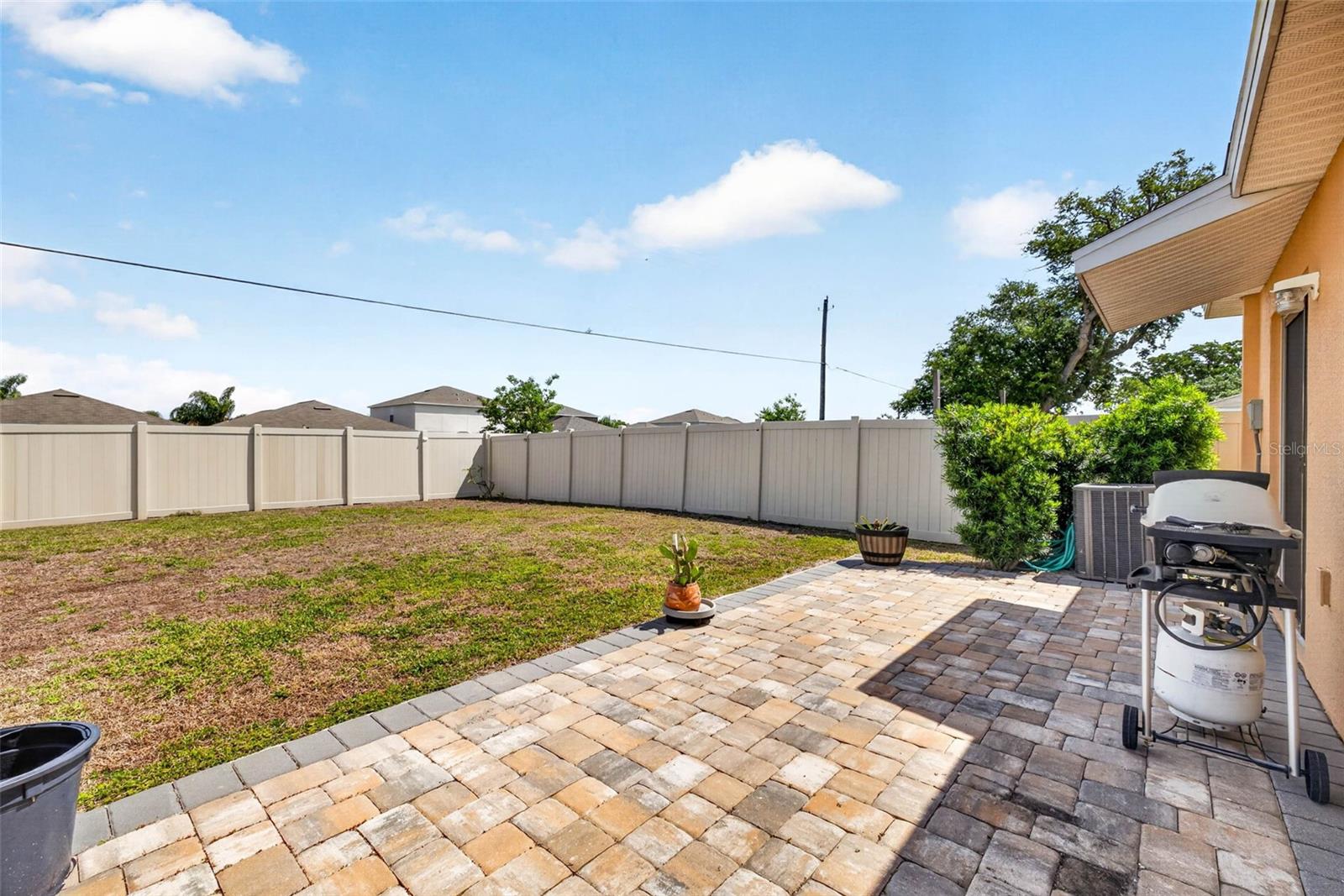 Pavered patie in fully fenced back yard. No backyard neighbors.