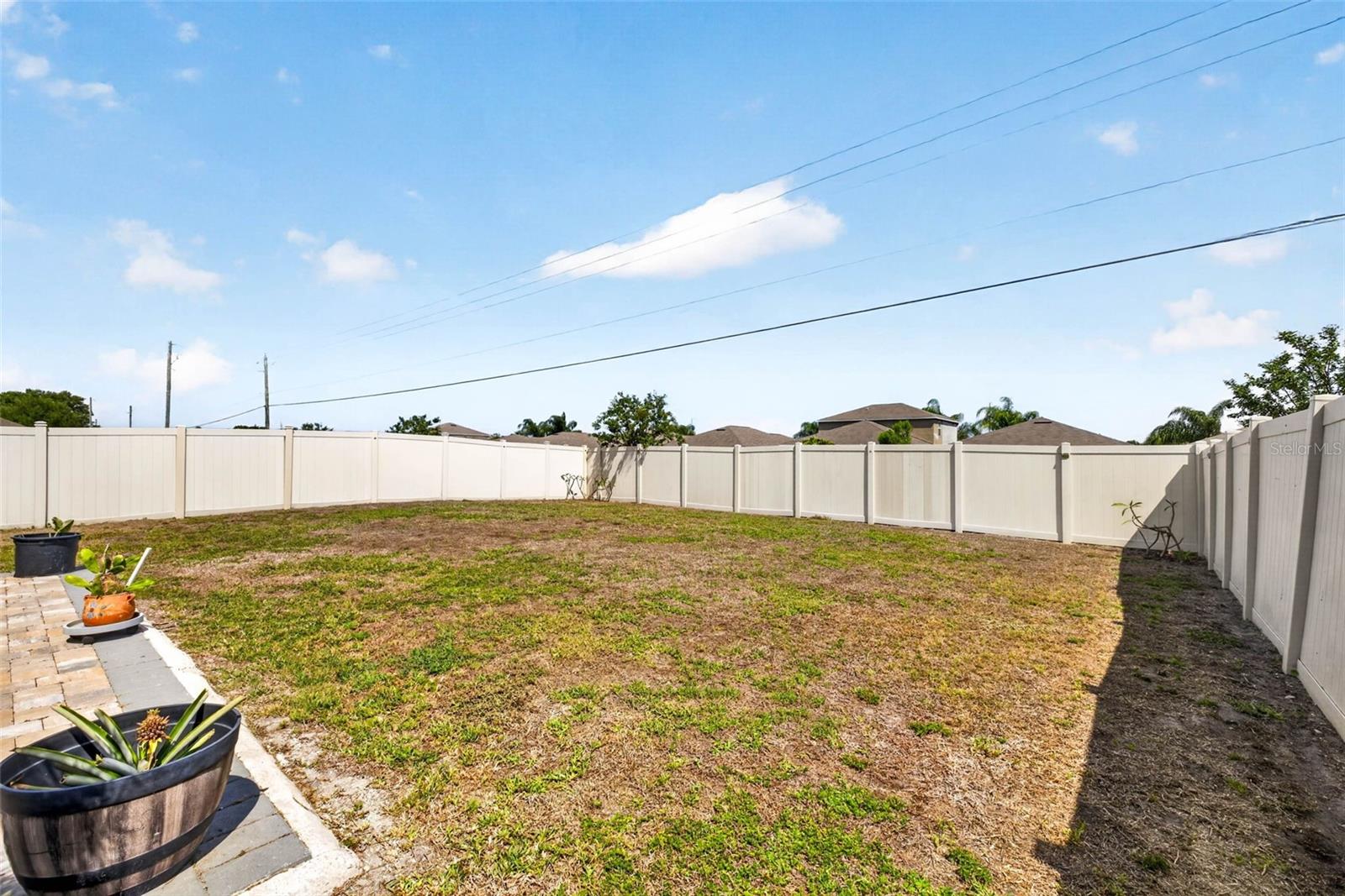 Large, fully fenced back yard.