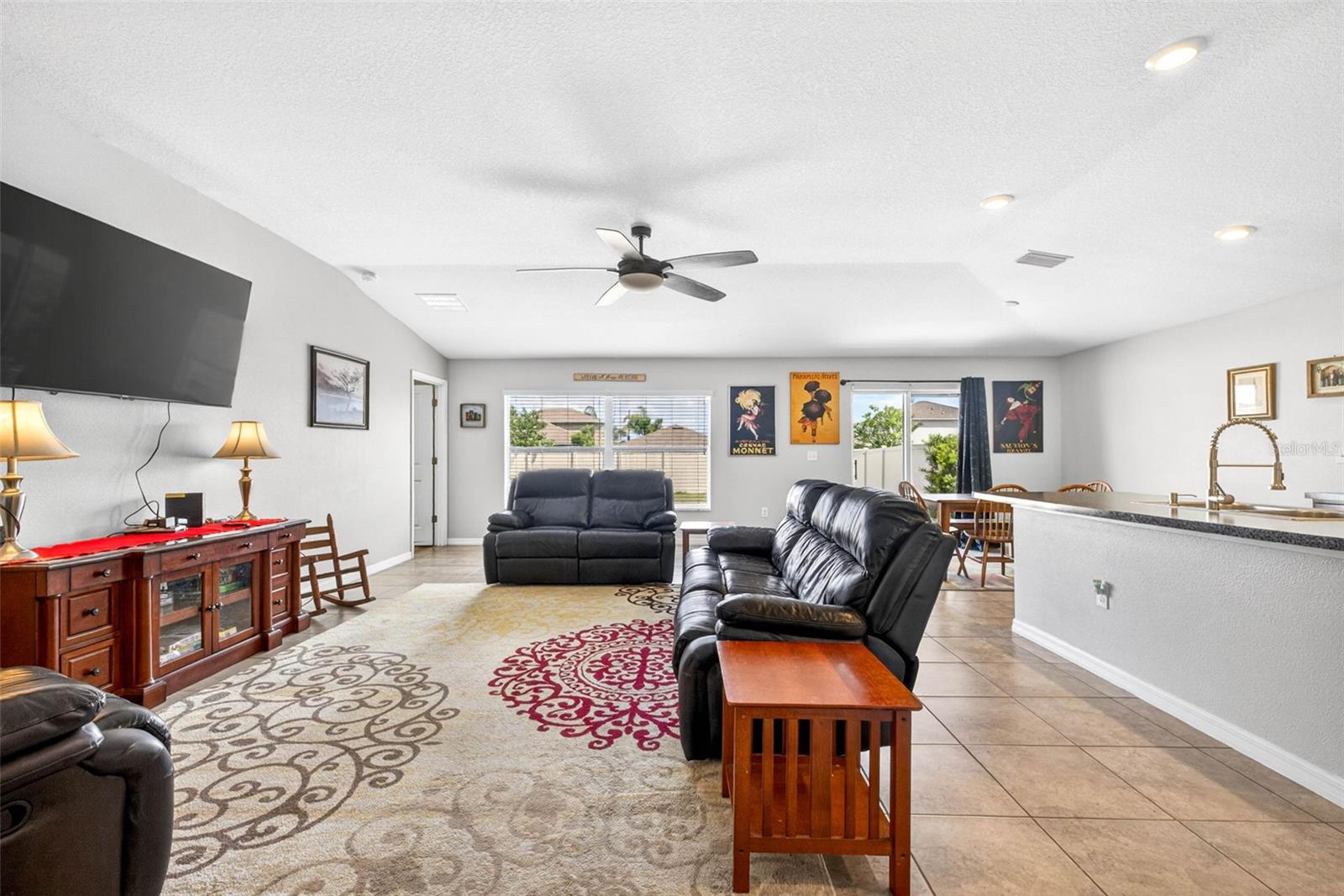 Open floor plan features living/dining/kitchen combination complete with ceiling fan