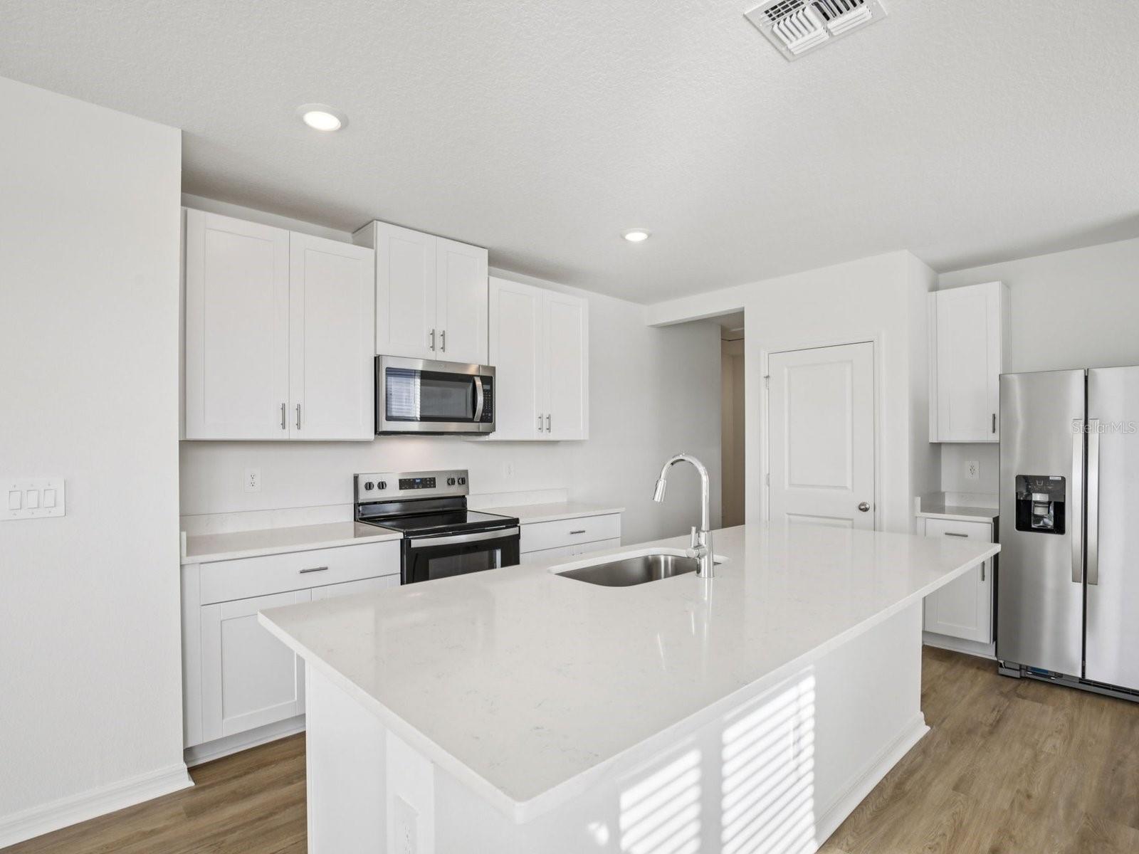 Interior photos are not of the actual home but are photos of the builder home with the same floorplan with similar interior finishes and features.