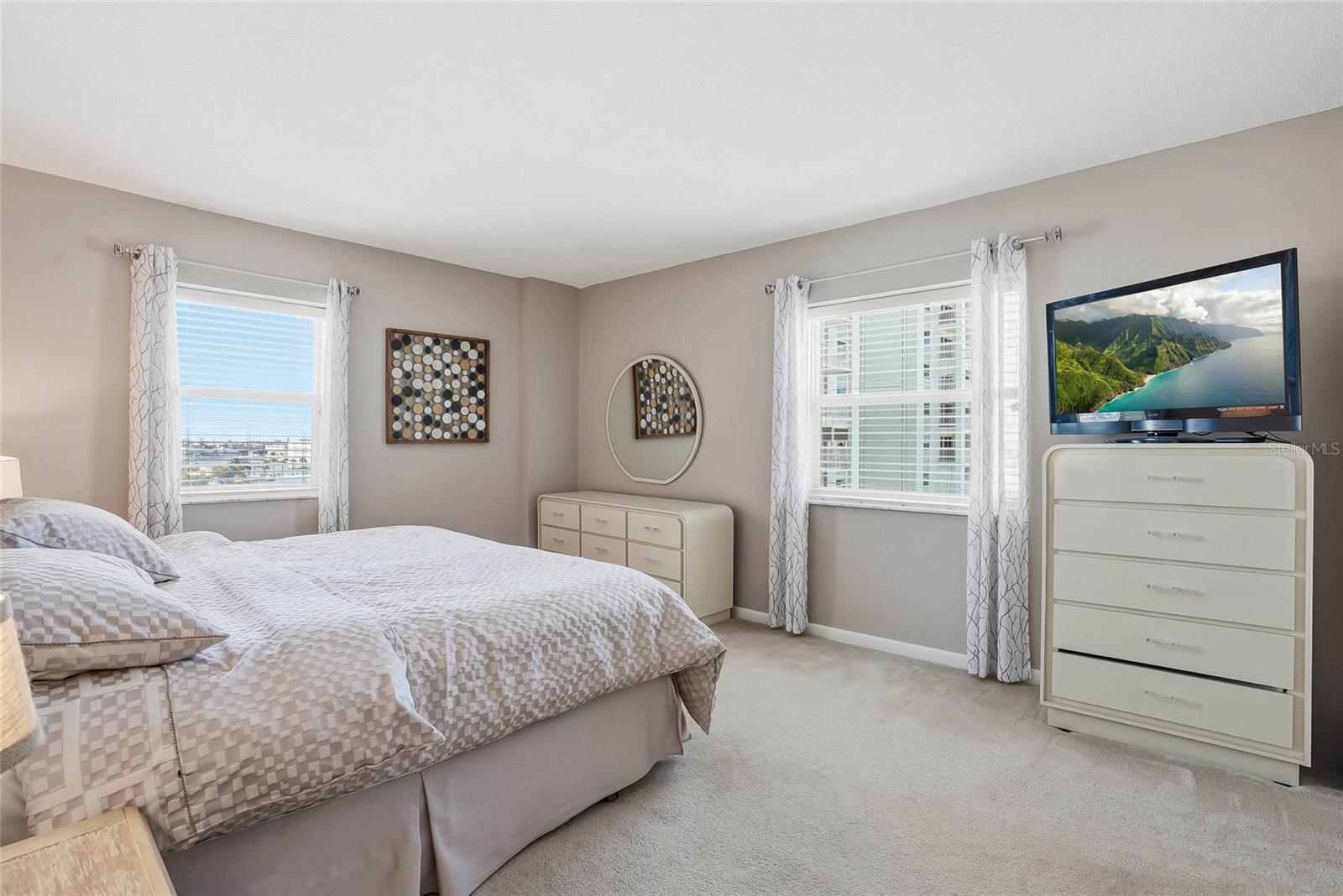 Primary Bedroom features 2 windows with water views.