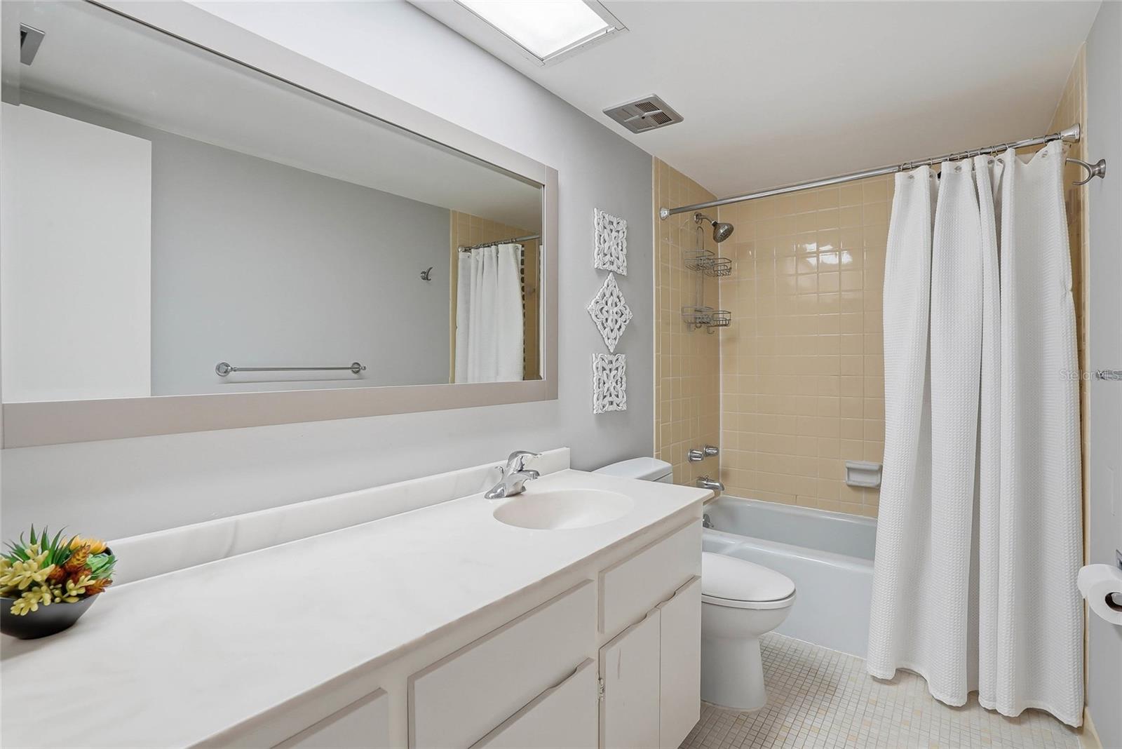 Primary Bathroom with tub and shower.